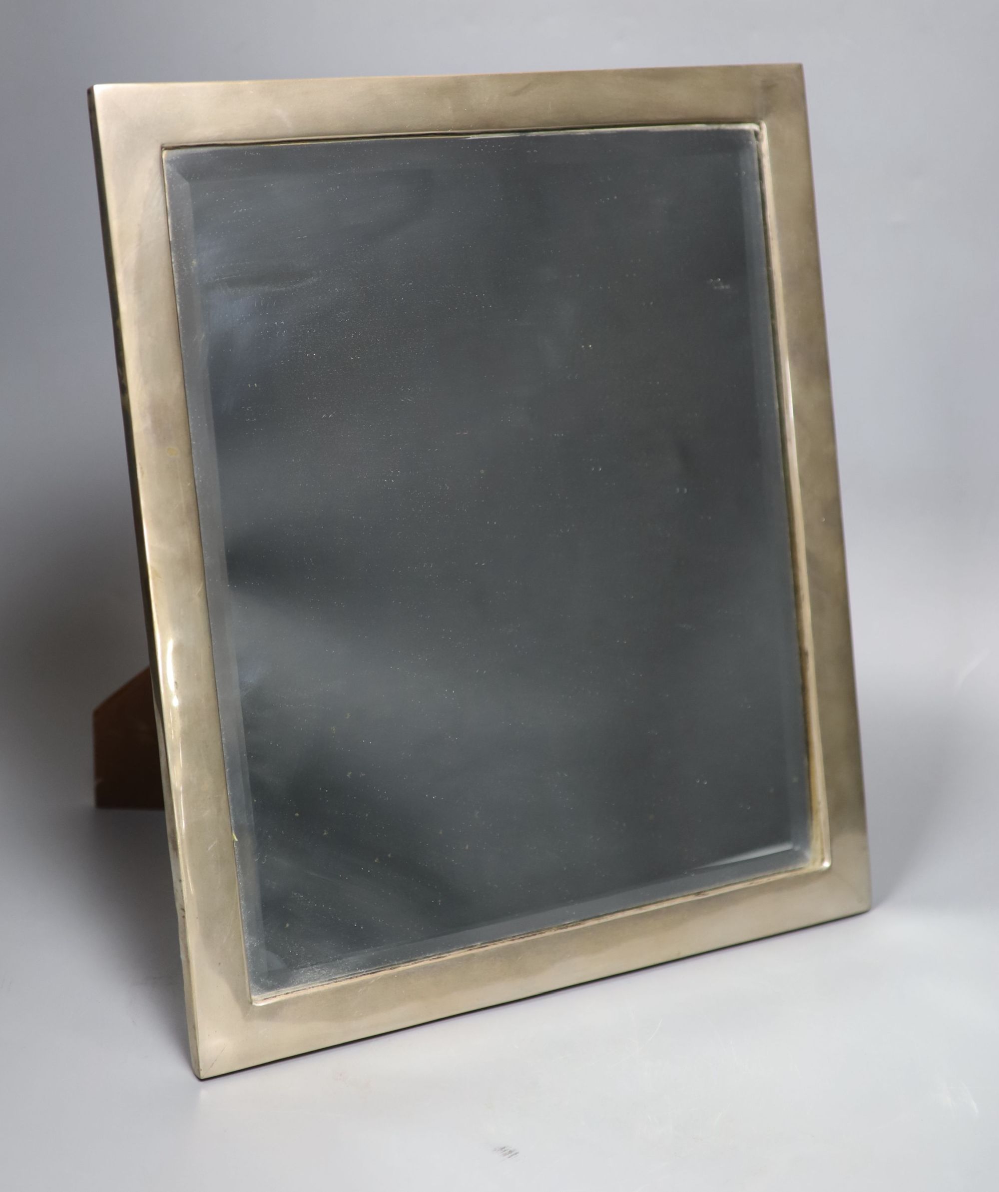 A sterling mounted wooden backed rectangular easel mirror, 39.7cm.